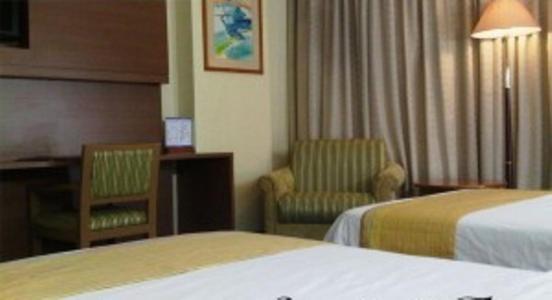 Novita Hotel Jambi Zimmer foto